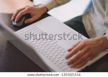 Man working with laptop in coffee house