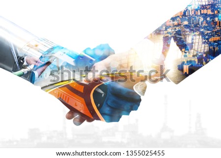 Cyber communication and robotic trend and artificial intelligence, autonomous car concepts. Industrial 4.0 Cyber Physical Systems concept. Robot and Engineer human holding hand with handshake.