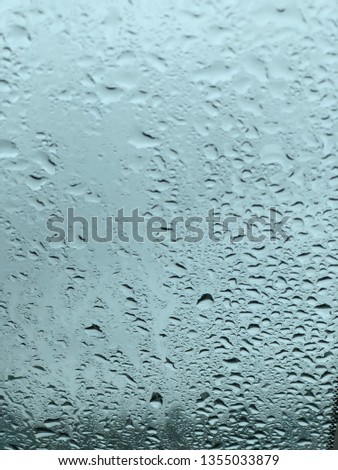 Raindrops on car window with sky  transparent 
