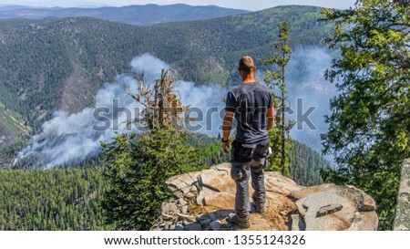 Hiker Stands On Cliff Edge Above Active Forest Fire, Smoke In Gila Wilderness New Mexico - Whitewater Baldy Fire 2012
