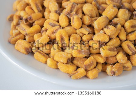 Toasted corn grains on a white background
