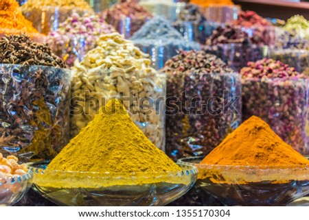 Variety of spices and herbs on the arab street market stall. Dubai Spice Souk, United Arab Emirates. 