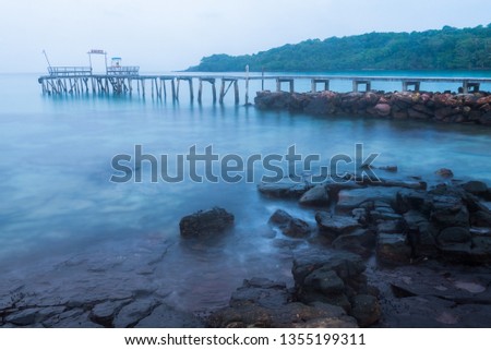 Wooden bridge to the pier in the calm morning at Koh kood, Trat, Thailand