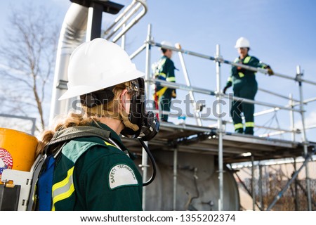 Workers on land fill gas site testing the system for safety