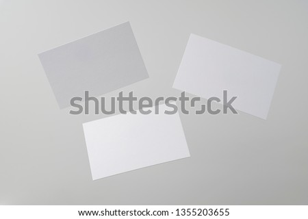 Design concept - front view of 3 surreal white business card float on mid air isolated on white background for mockup, it's real photo, not 3D render