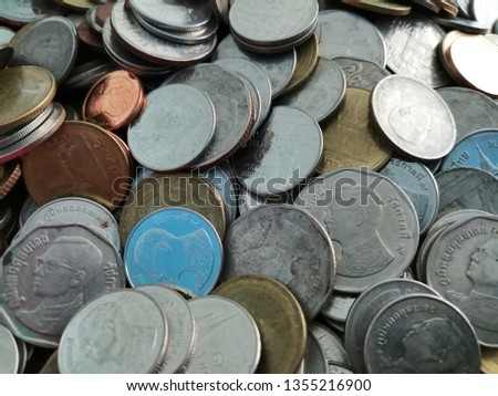 A pile of Thai coins, selective focus and blurred photo for business and finance background.