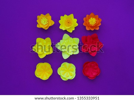 Decorative flowers made from craft paper on purple background. Handwork. Spring Holiday Postcard. Mothers Day. Beautiful composition.