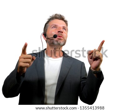 young attractive and confident successful man with headset speaking at corporate business coaching and training auditorium conference room talking giving motivation training isolated on white