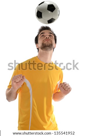 Portrait of soccer player heading ball isolated over white background