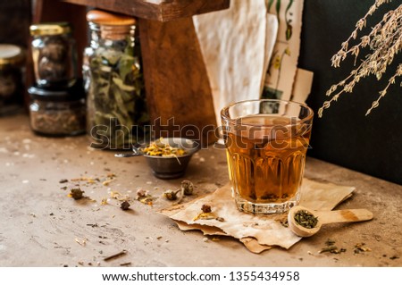 Herbal Tea in a Glass and Variety of Dried Herb Mixes, copy space for your text