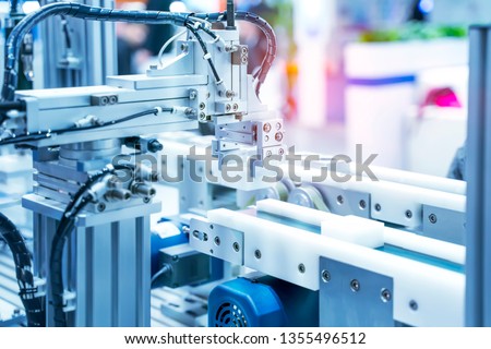 robotic and pneumatic piston unit on industrial machine,automation compressed air factory production Royalty-Free Stock Photo #1355496512