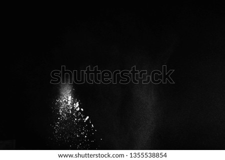  White powder explosion on black background. Colored cloud. Colorful dust explode. Paint Holi.
