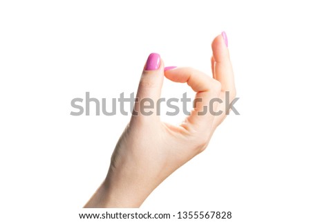 Beauty woman hands with pink fashion manicure. Isolated image close up