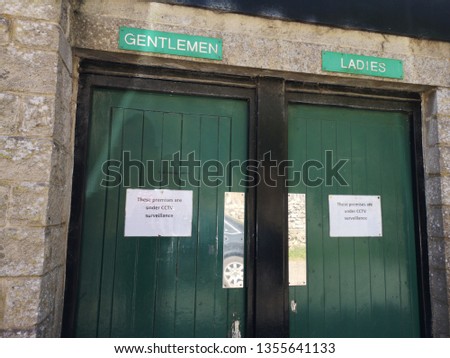 The doors to some ladies and gentlemen public toilets
