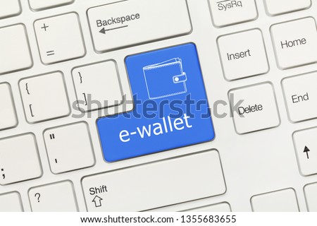 Close-up view on white conceptual keyboard - e-wallet (blue key)