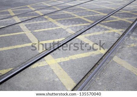 Tram rails with road traffic signage, vehicle and transportation