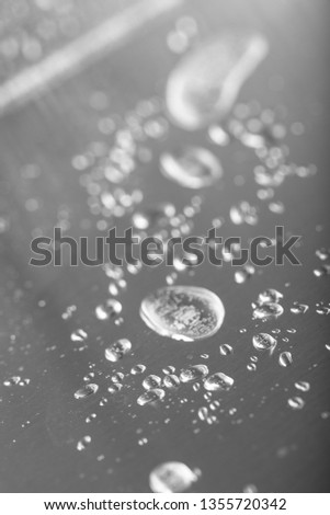 Drops of water in a metal sink on a modern kitchen.