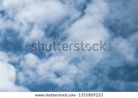 Blue sky with white clouds. Texture of cloudscape. Grey sky background with clouds. Dramatic scene