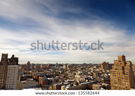 High angle view to the west at the snow covered rooftops of the West Village in Manhattan, on a lovely sunny day.