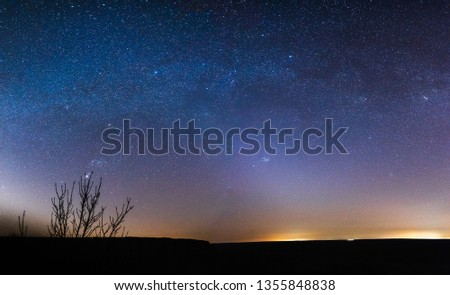 starry sky at night in the steppes of the Rostov region, Russia with tracks from airplanes