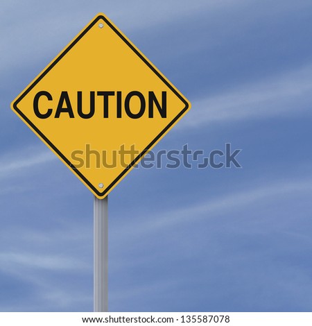 A warning sign against a blue sky background