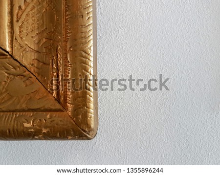 Gold frame border next to the wall