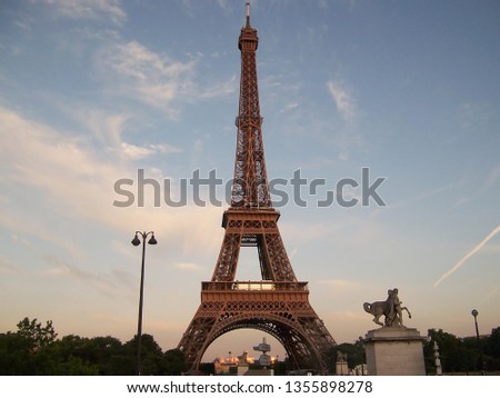 Eiffel tower isolated over blue sky at sunset