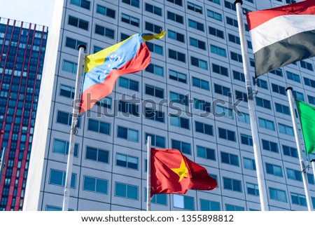 Flags of European states on flagpoles against the background of a cloudy sky. flags of foreign countries on flagpoles, international summit of European states