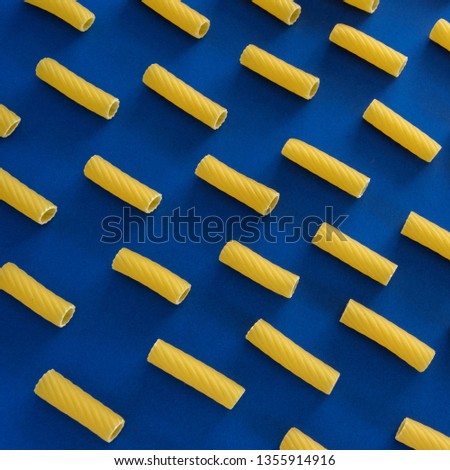 Abstract food background, Italian pasta products on blue background
