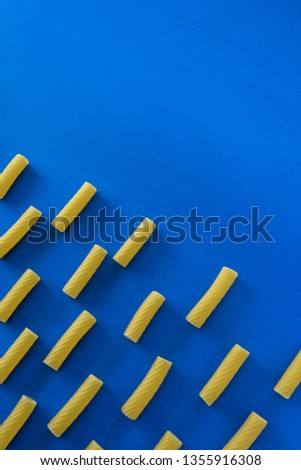 Abstract food background, Italian pasta products on blue background
