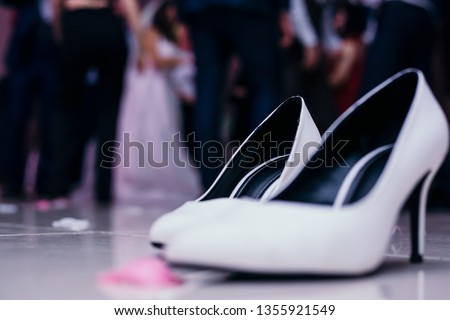 wedding shoes taken off Royalty-Free Stock Photo #1355921549