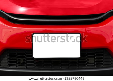 Horizontal shot of a blank white front license plate on a red car with copy space. Royalty-Free Stock Photo #1355980448