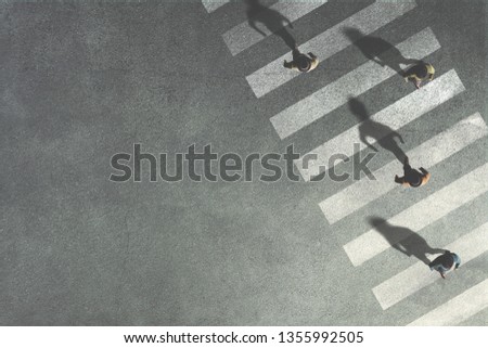 men crossing the street at crossroads