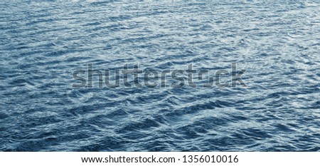 Water texture with waves during windy weather