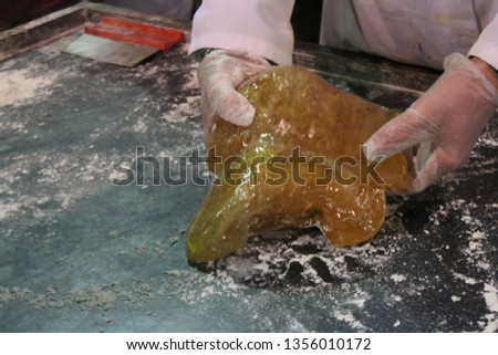 hand making hard candy rock sweets popular at seaside rock stock, photo, photograph, picture, image