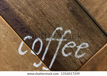 Hand writing. White wording coffee on wood wall. Copy space for any text design. Modern. Business, marketing concept.