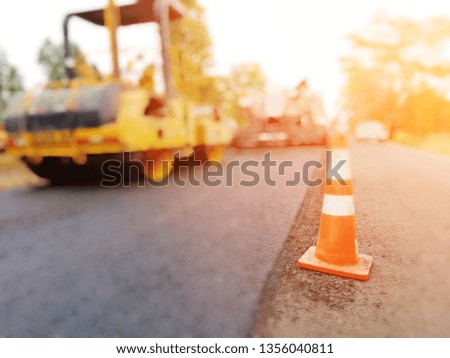 Road construction by burning asphalt road Then paved with new asphaltic concrete materials, blurred images