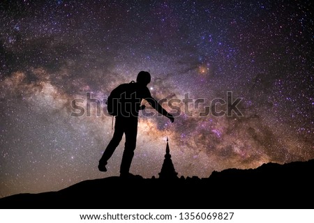 Photographer, star and Milky Way in the night sky