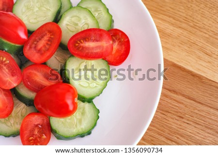 Sliced Cucumbers and Cherry Tomatoes. Close up.
