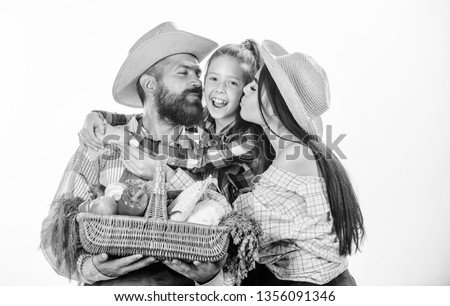 Family farmers hug hold basket fall harvest. Family gardeners basket harvest isolated white background. Family gardening. Family farm concept. Parents and daughter farmers celebrate harvest holiday.