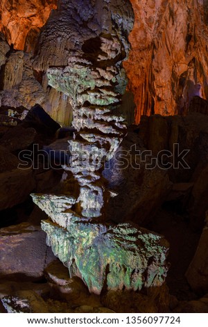 Amazing geological forms in Tien Son Cave near Phong Nha, Vietnam. Limestone cave full of stalactites and stalagmites.