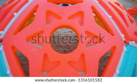 The red star of a big toy ball in the playground on the white beach in Rimini Italy in Italy