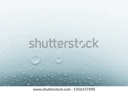 Rain droplets on glass background, Water drops on white background , texture .
