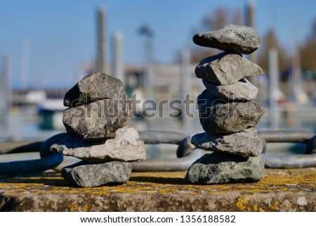 stacked stones on harbor wall at port of Altnau. lake Bodensee. CH Swizterland