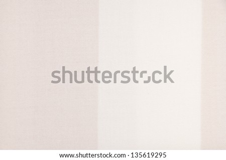 Background from a beige material with stripes.