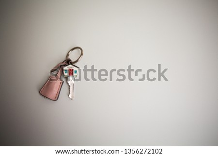 House shaped key on a paper background