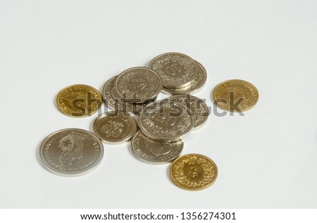 Swiss franc. Coins on white background. Royalty-Free Stock Photo #1356274301