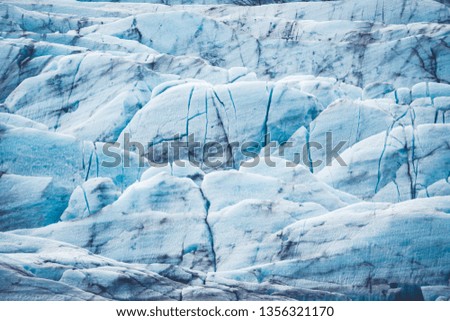 A closeup shot of a blue glacier