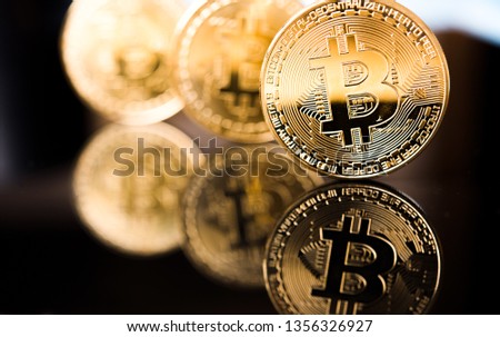 Golden Bitcoin on black backround. New virtual money. crypto currency