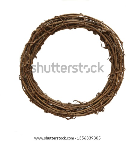 Easter decorations. Empty Nest of wicker isolated on white background. Decorative wreath, blank for collage with path, top view